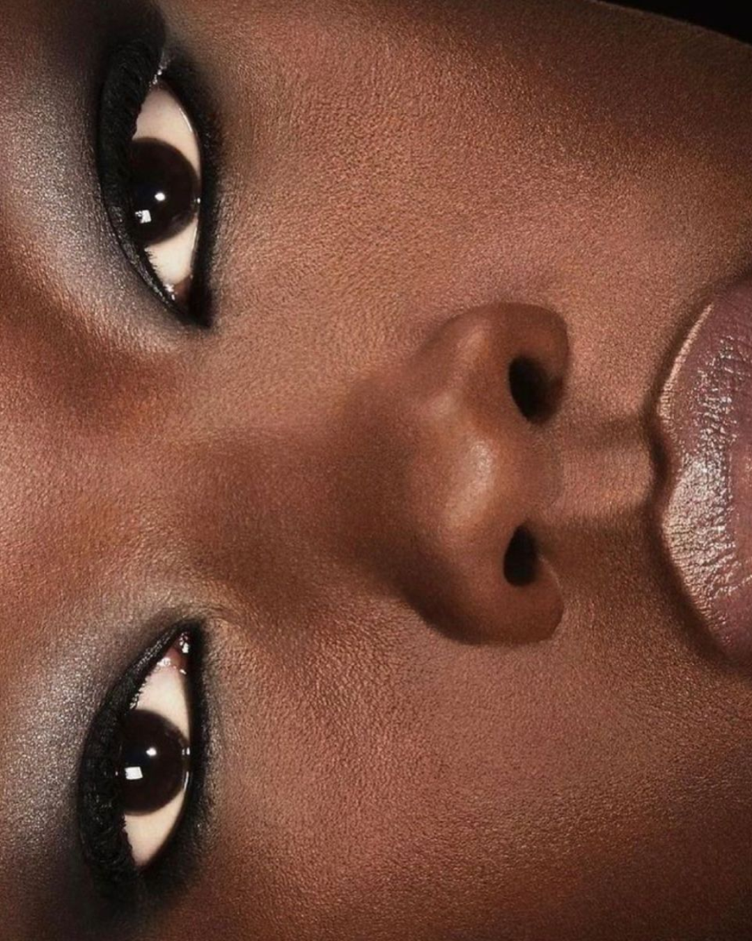 Model with melanated skin